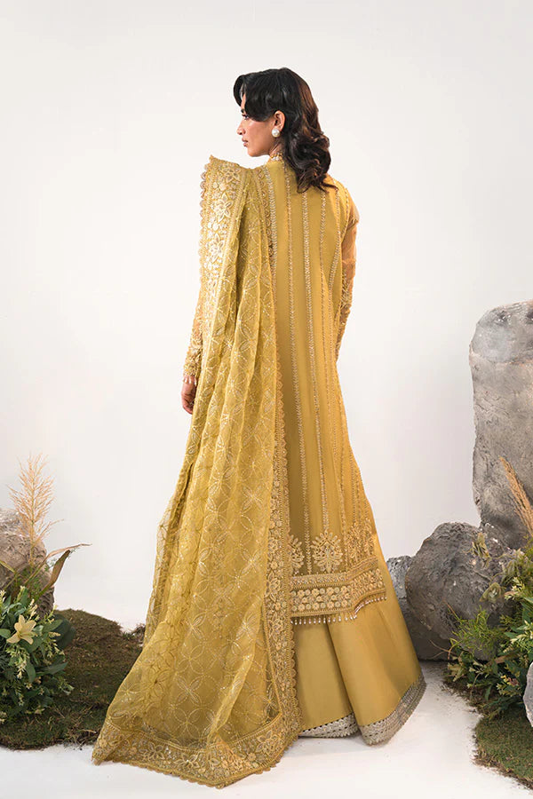 Model in Saffron Elmira, Pakistani festive dress, UK exclusive.