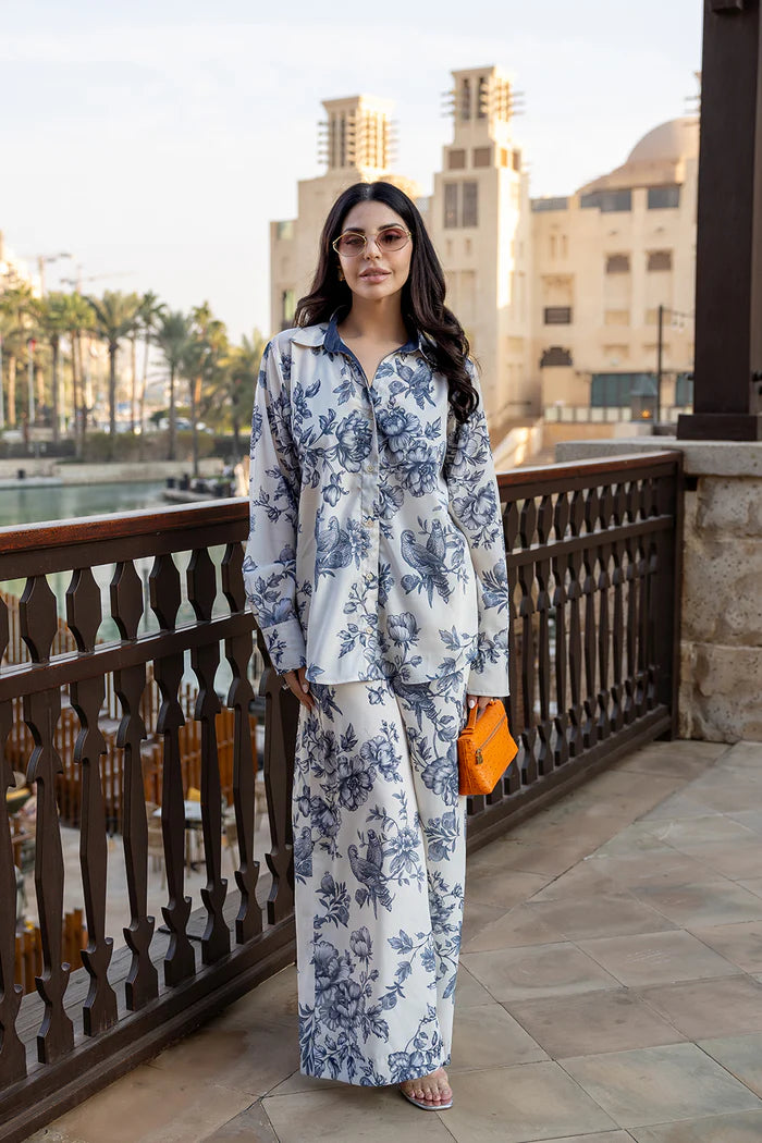Model wearing white co-ord set with navy floral print from Saira Rizwan, Pakistani luxury pret, Pakistani clothes online in UK.