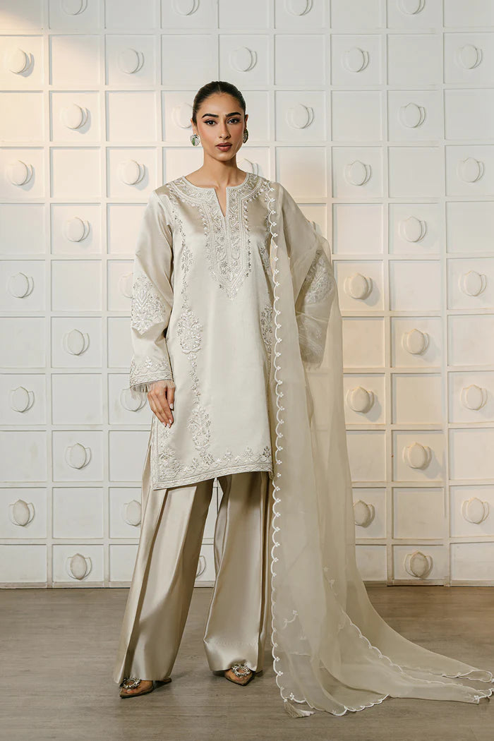 Model wearing ivory ELIYA-SREP1-01 from Saira Rizwan Luxury Lawn Eid Edit '25, perfect Pakistani luxury pret for UK desi fashion lovers.