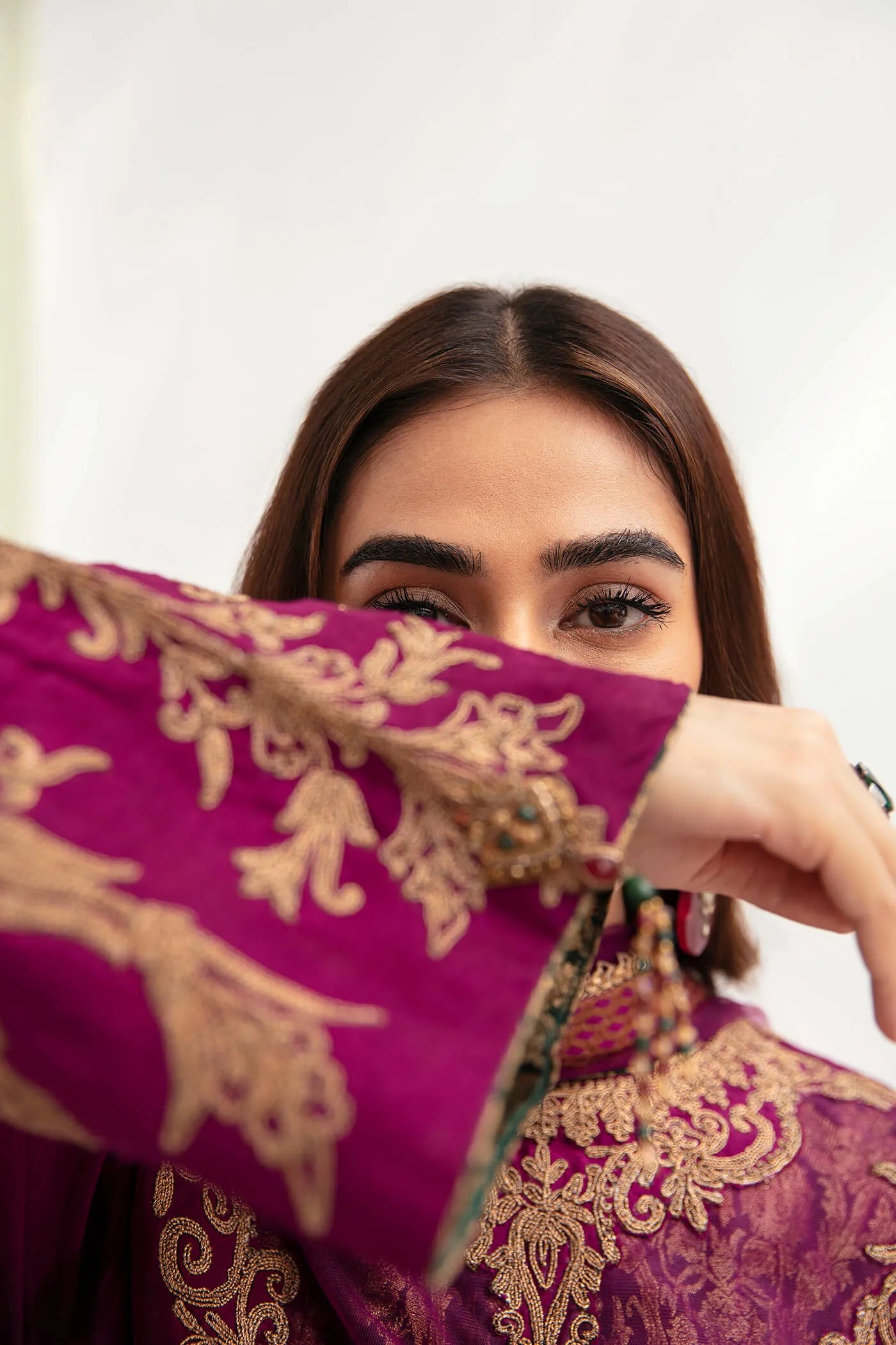 Model wearing VIVA LA VIDA's MAUVE PASSION, an equisite mold by Musferah Saad UK, Pakistani Clothes UK.