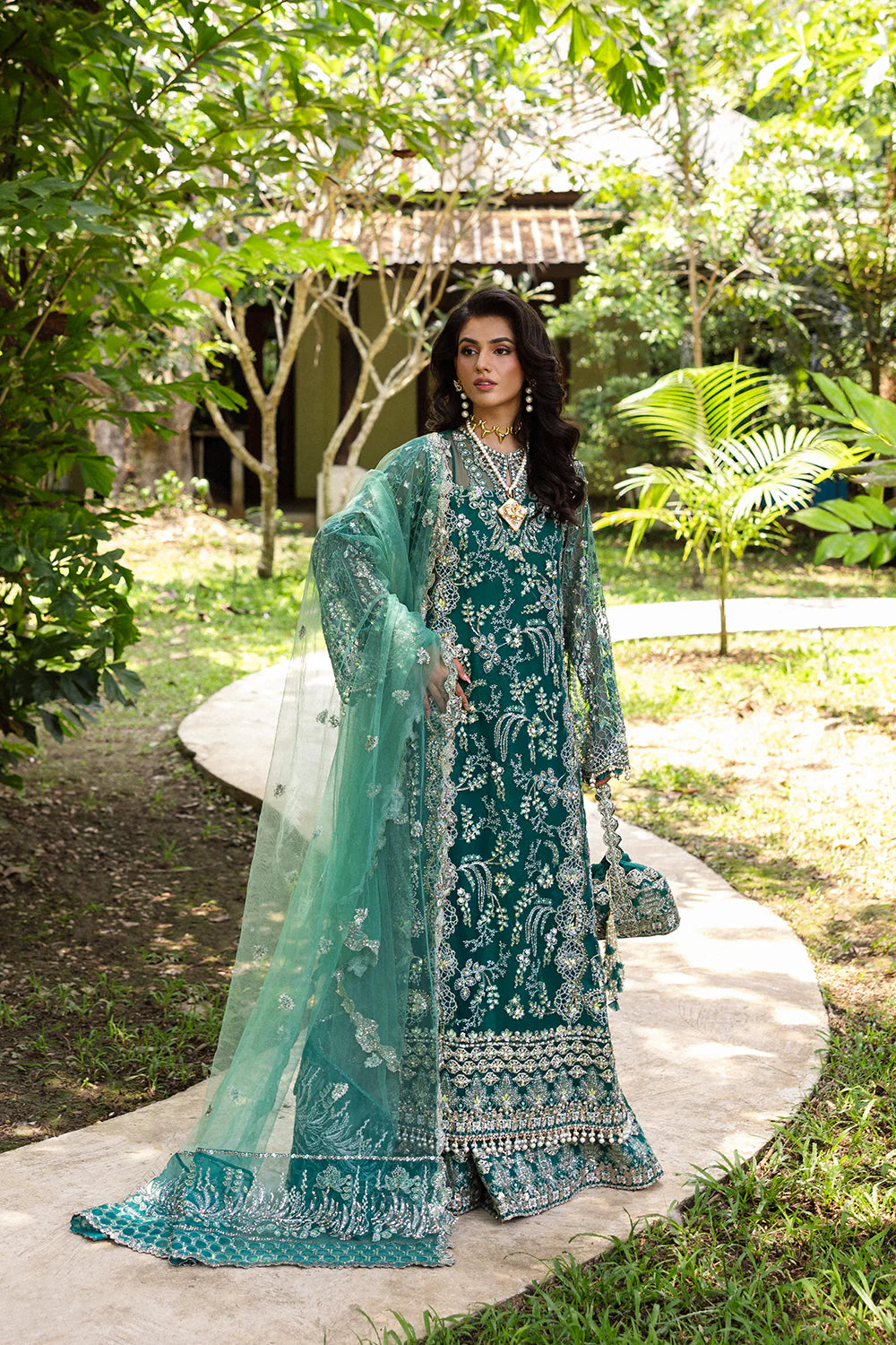 Model wearing Saira Rizwan KIANA-SRF25-04 in emerald green with silver embellishments – Pakistani luxury pret, shop online in UK.