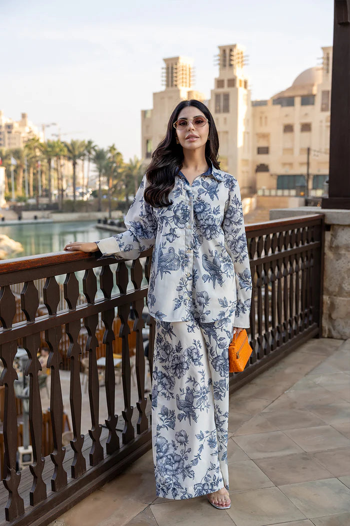 Model wearing white co-ord set with navy floral print from Saira Rizwan, Pakistani luxury pret, Pakistani clothes online in UK.