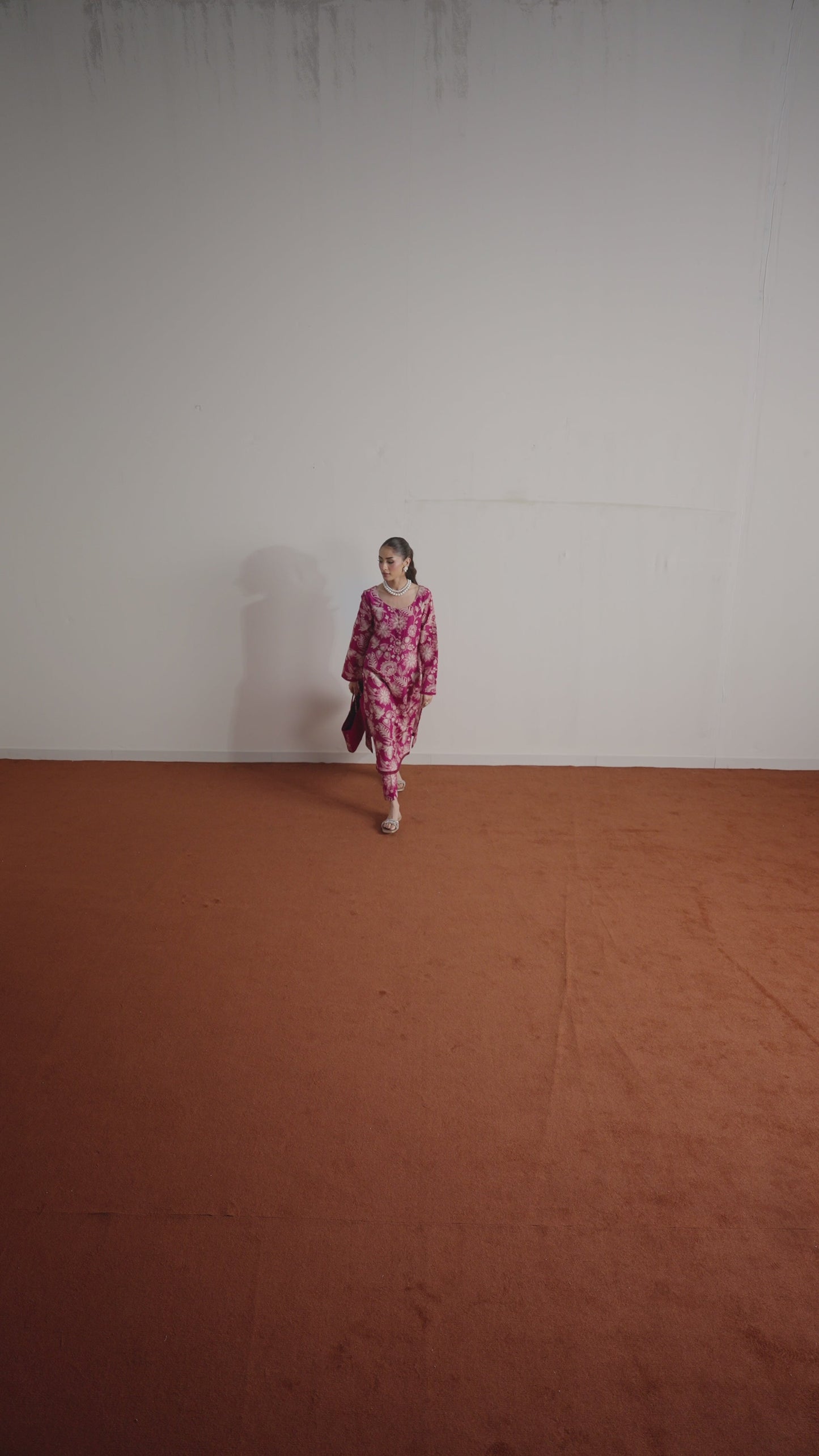Model wearing Rosalee from Gulaal in a deep pink printed co-ord set with ivory floral patterns, perfect for Pakistani luxury pret in the UK.