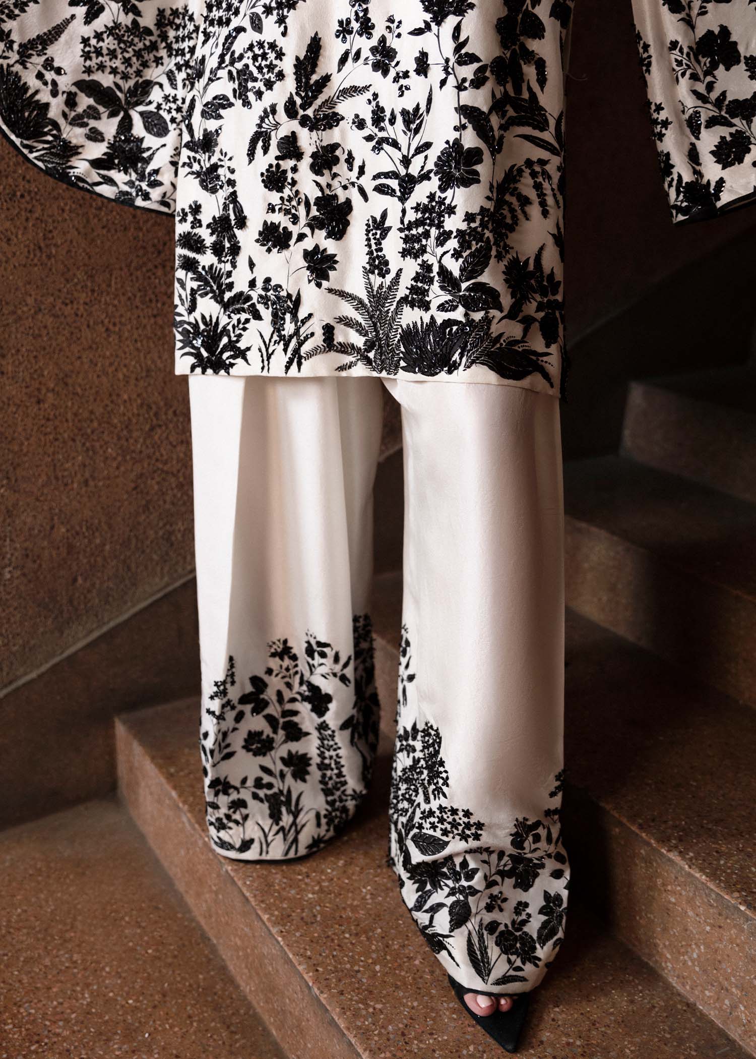 Model wearing a black and white Tusk dress from Hussain Rehar's Luxury Pret Eid '24 collection. Pakistani clothes online in UK.