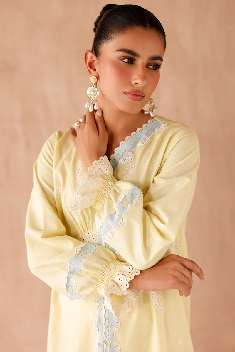 Model wearing yellow embroidered coords EP-10 Elin from Qalamkar, Pakistani luxury pret available online in UK.