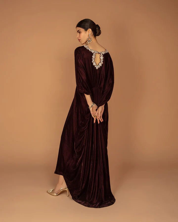 Model wearing a burgundy Adiba dress from Faiza Saqlain's Aleira Evening Edit '24 collection. Pakistani clothes online in UK.