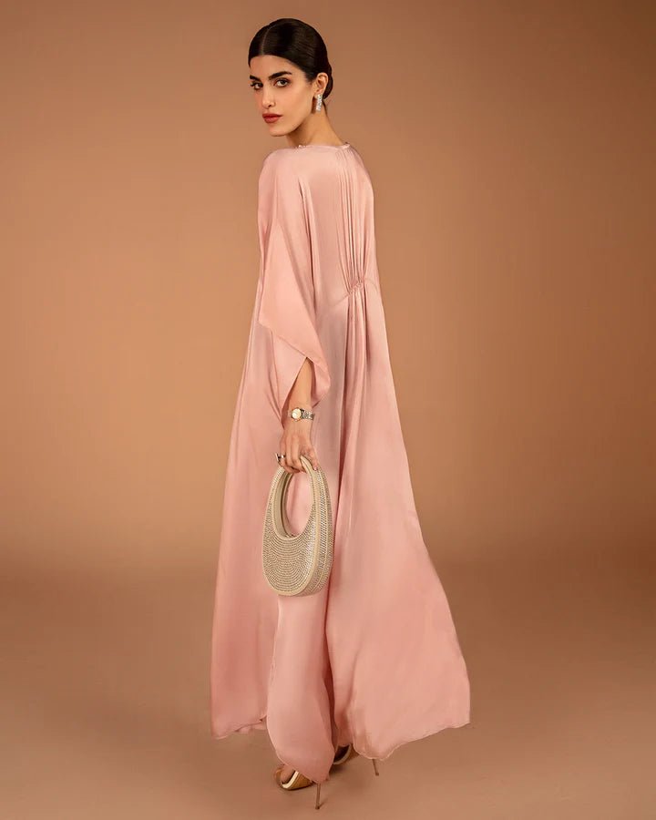 Model wearing a pink Derifa dress from Faiza Saqlain's Aleira Evening Edit '24 collection. Pakistani clothes online in UK.