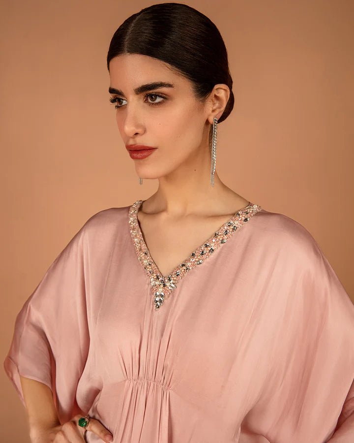 Model wearing a pink Derifa dress from Faiza Saqlain's Aleira Evening Edit '24 collection. Pakistani clothes online in UK.