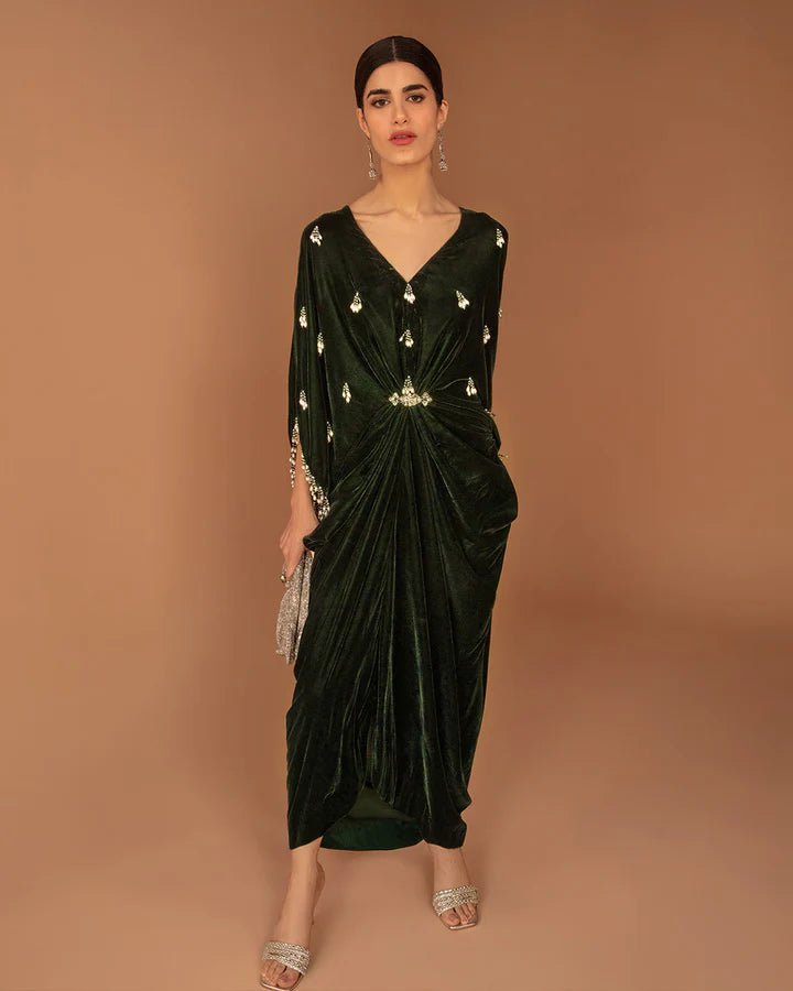 Model wearing a green Perin dress from Faiza Saqlain's Aleira Evening Edit '24 collection. Pakistani clothes online in UK.