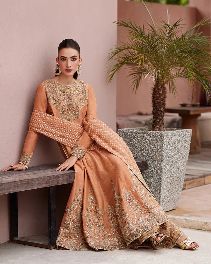 Model wearing a rust - colored Dalisay dress from Faiza Saqlain's Lenora Luxury Pret '24 collection. Pakistani clothes online in UK.