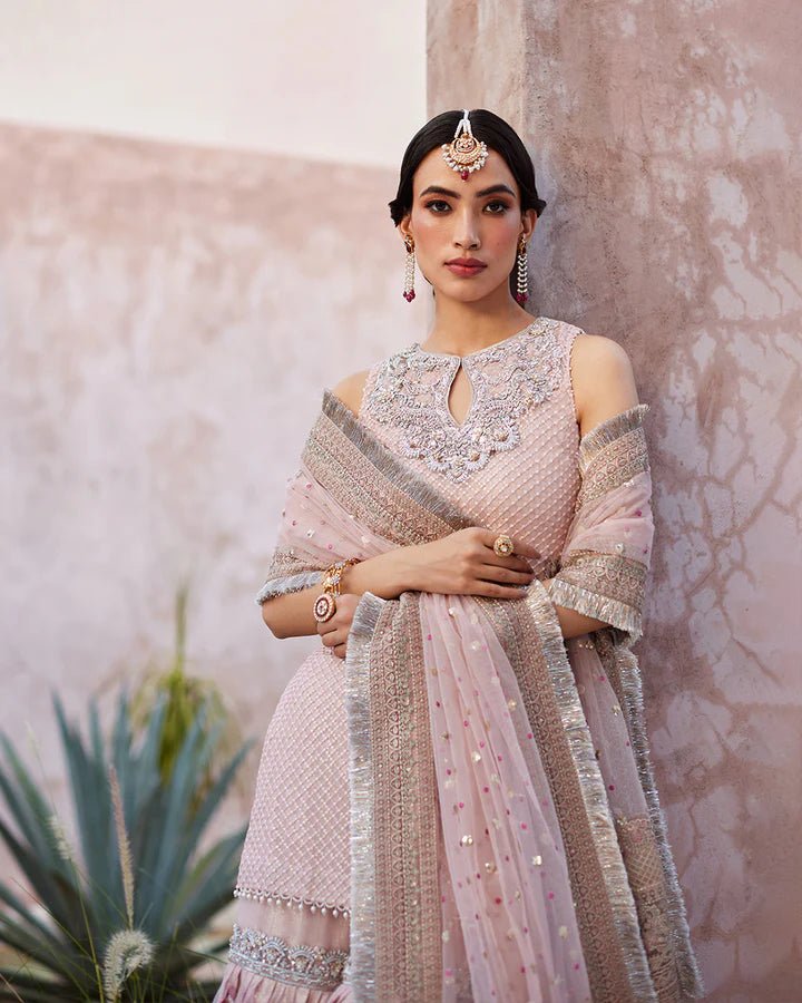 Model wearing a pink Eilees dress from Faiza Saqlain's Lenora Luxury Pret '24 collection. Pakistani clothes online in UK.