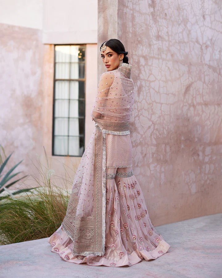 Model wearing a pink Eilees dress from Faiza Saqlain's Lenora Luxury Pret '24 collection. Pakistani clothes online in UK.