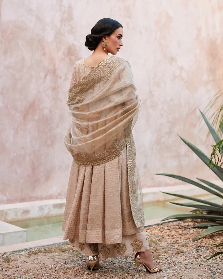 Model wearing a beige Moira dress from Faiza Saqlain's Lenora Luxury Pret '24 collection. Pakistani clothes online in UK.