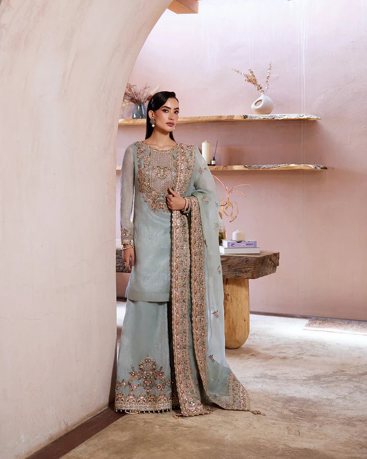 Model wearing a pastel blue Zaafia dress from Faiza Saqlain's Lenora Luxury Pret '24 collection. Pakistani clothes online in UK.