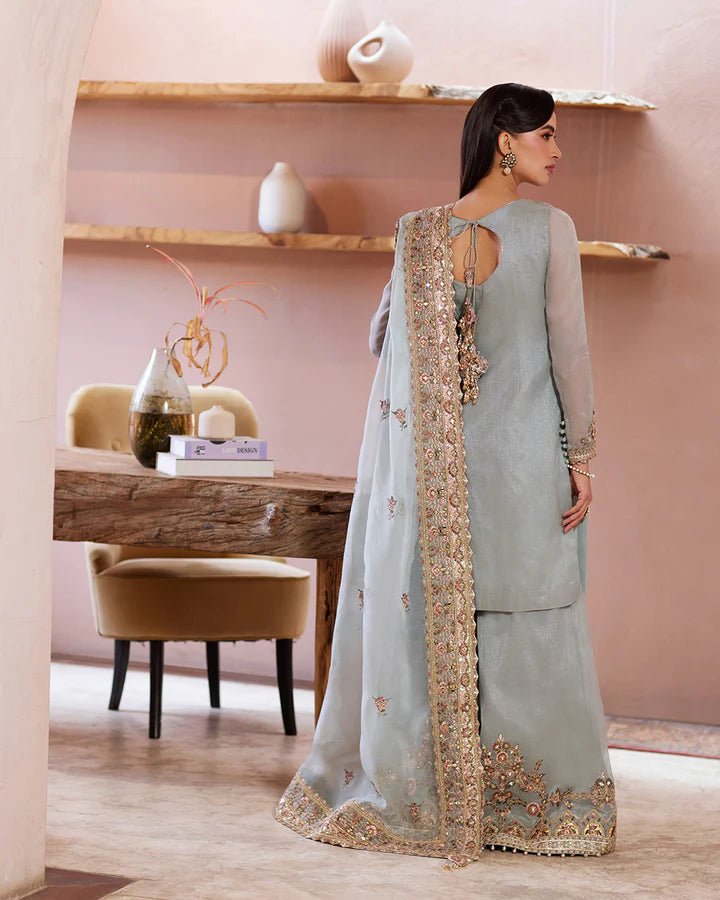 Model wearing a pastel blue Zaafia dress from Faiza Saqlain's Lenora Luxury Pret '24 collection. Pakistani clothes online in UK.