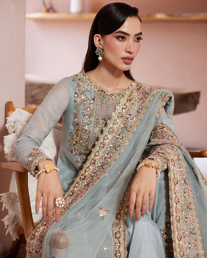 Model wearing a pastel blue Zaafia dress from Faiza Saqlain's Lenora Luxury Pret '24 collection. Pakistani clothes online in UK.