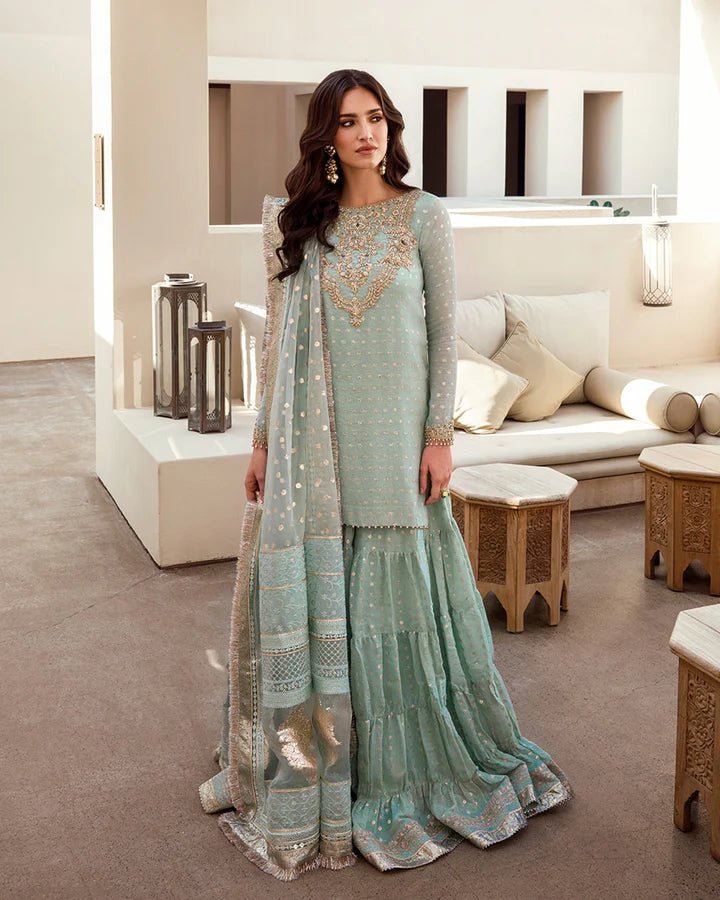 Model in Faiza Saqlain UK Sefana, elegant Pakistani clothes UK in soft green, Noor e Chashm Feb '23 collection.