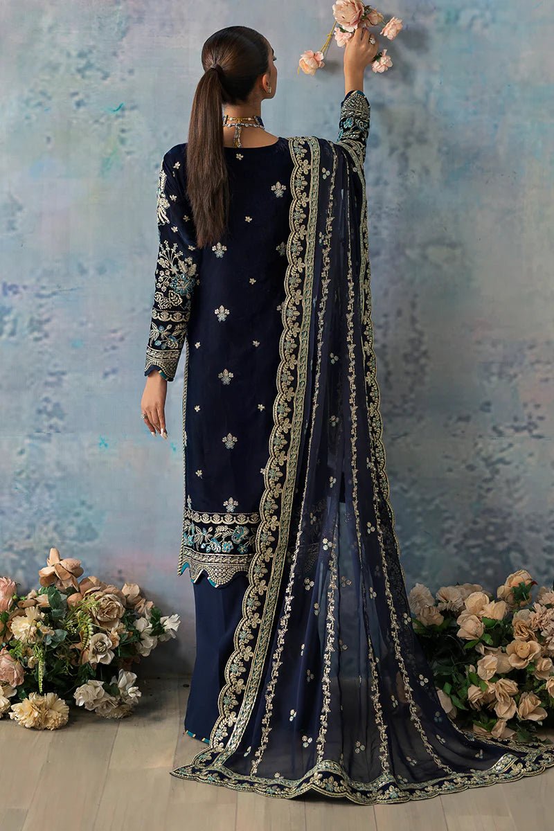 Model wearing Azure from Gulaal's Celeste Unstitched Velvet '24 collection in royal blue. Luxury pret, festive, Pakistani clothes online in UK.