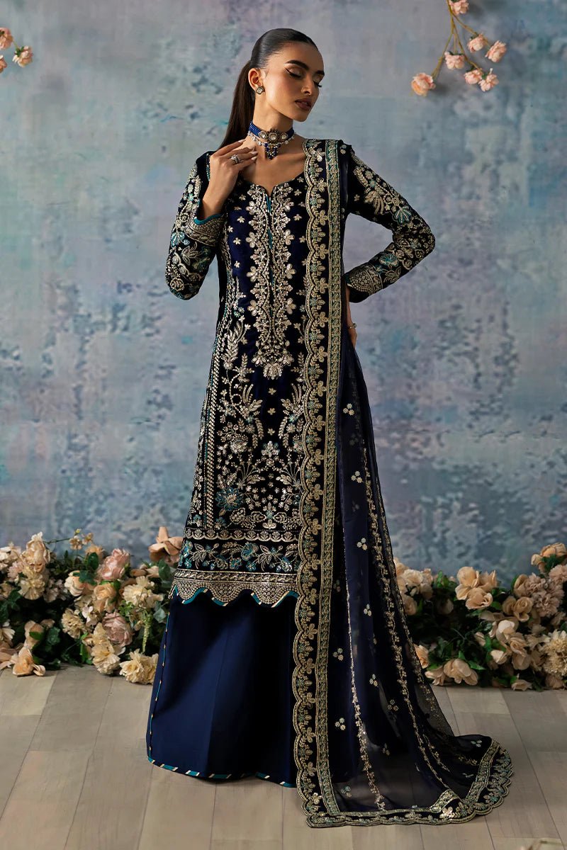 Model wearing Azure from Gulaal's Celeste Unstitched Velvet '24 collection in royal blue. Luxury pret, festive, Pakistani clothes online in UK.