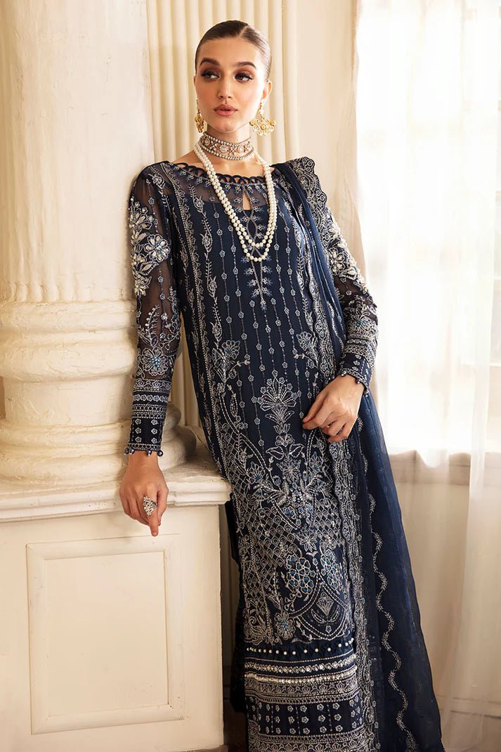 Model wearing Gulaal Embroidered Chiffon 24 Evara dress in navy blue, Pakistani wedding clothes online in UK.