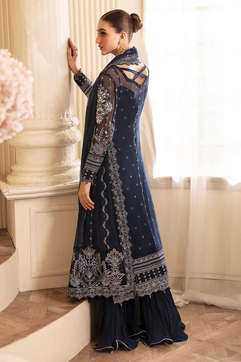 Model wearing Gulaal Embroidered Chiffon 24 Evara dress in navy blue, Pakistani wedding clothes online in UK.