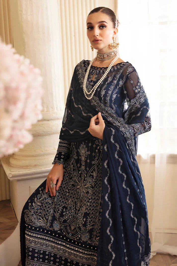 Model wearing Gulaal Embroidered Chiffon 24 Evara dress in navy blue, Pakistani wedding clothes online in UK.