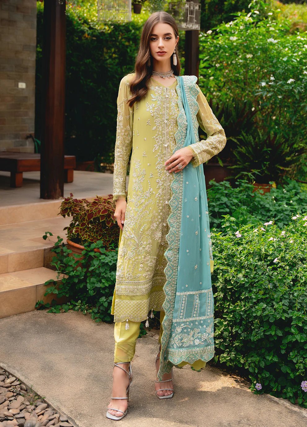 Model wearing Gulaal AMARY dress, a blend of olive and sea green, perfect for Pakistani clothes UK enthusiasts.