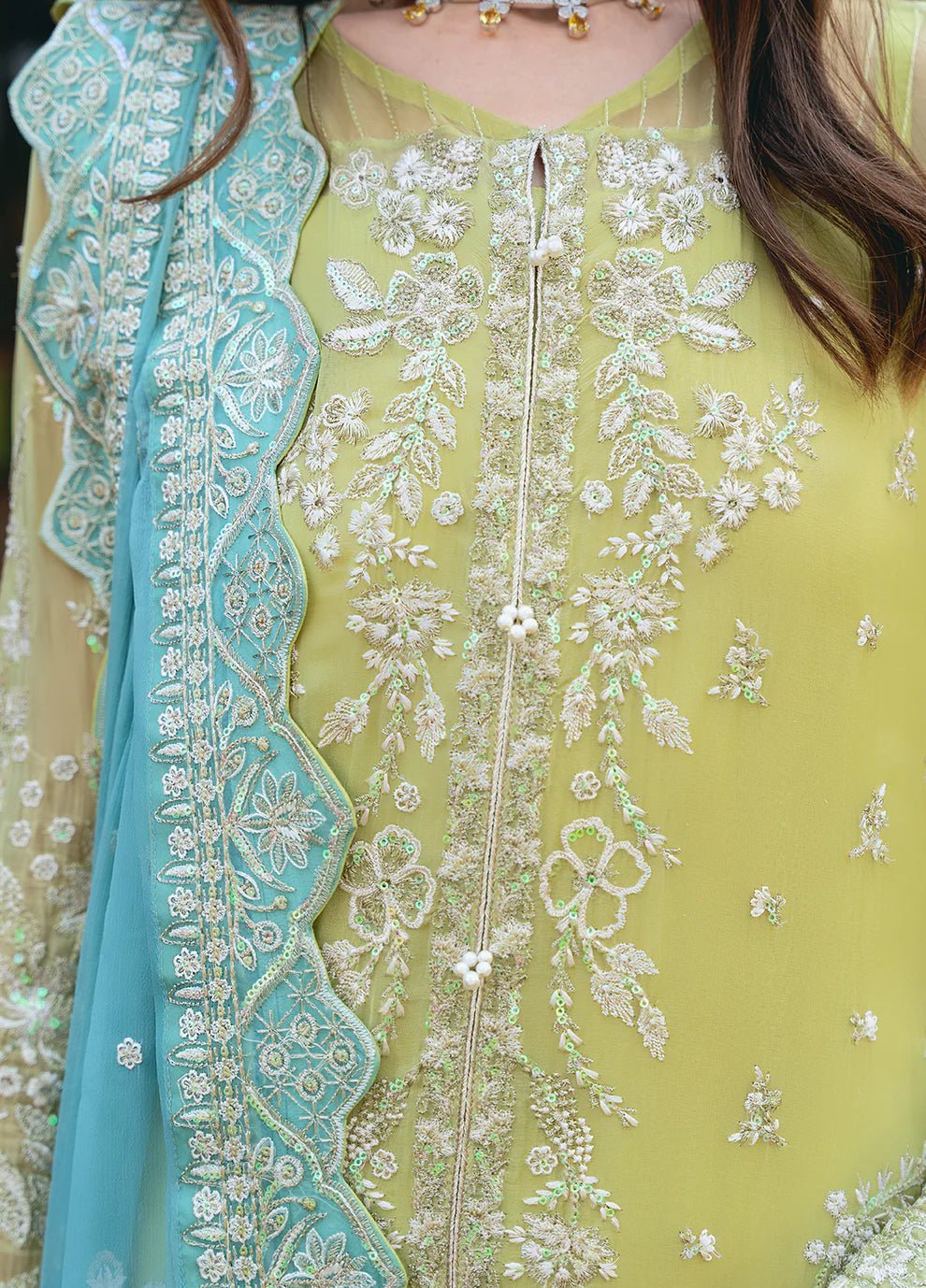 Model wearing Gulaal AMARY dress, a blend of olive and sea green, perfect for Pakistani clothes UK enthusiasts.