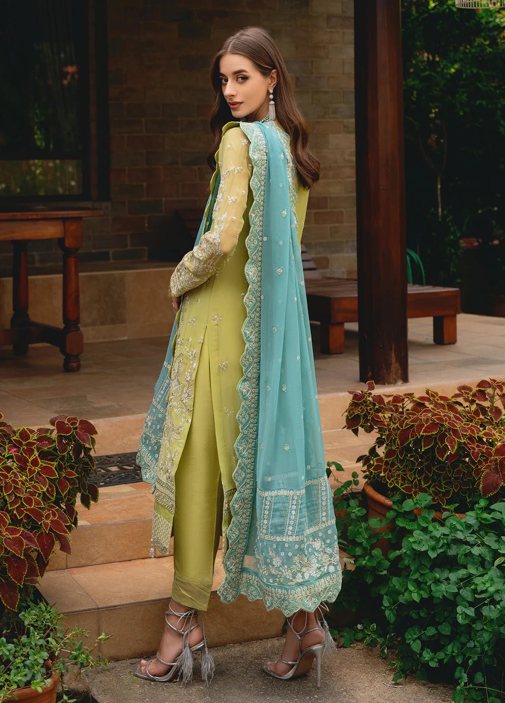 Model wearing Gulaal AMARY dress, a blend of olive and sea green, perfect for Pakistani clothes UK enthusiasts.