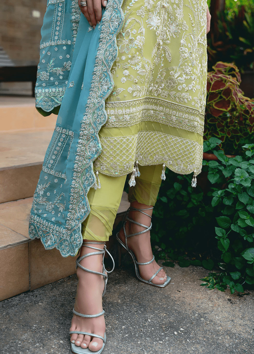 Model wearing Gulaal AMARY dress, a blend of olive and sea green, perfect for Pakistani clothes UK enthusiasts.