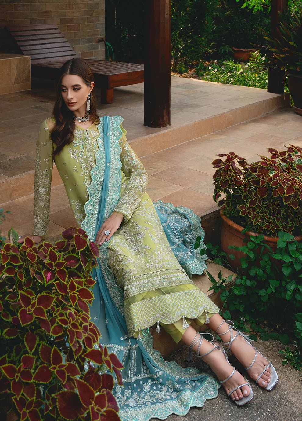 Model wearing Gulaal AMARY dress, a blend of olive and sea green, perfect for Pakistani clothes UK enthusiasts.