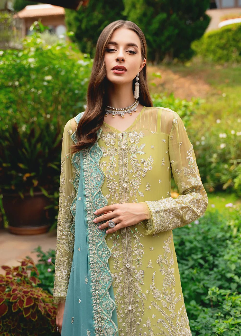 Model wearing Gulaal AMARY dress, a blend of olive and sea green, perfect for Pakistani clothes UK enthusiasts.
