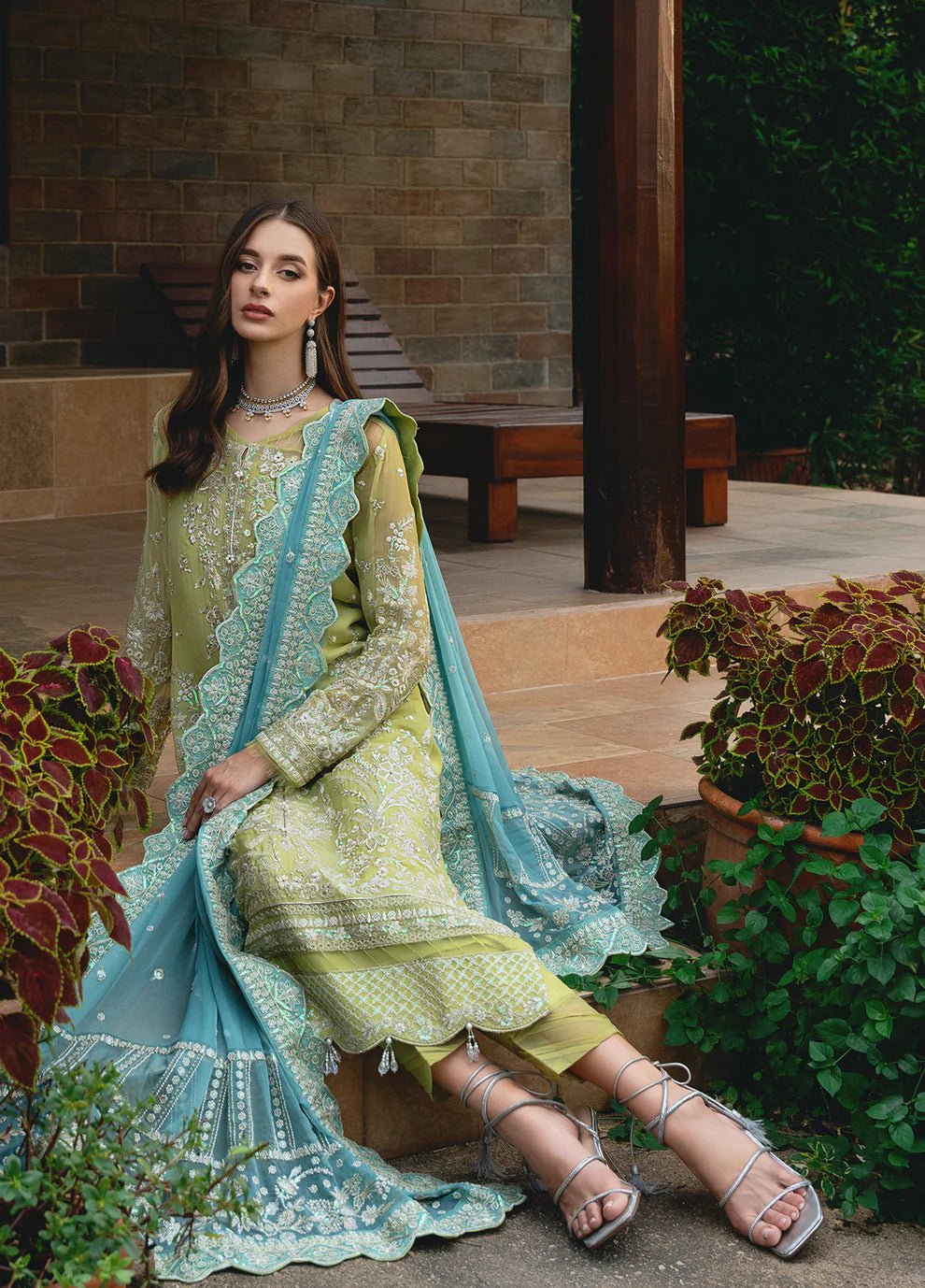 Model wearing Gulaal AMARY dress, a blend of olive and sea green, perfect for Pakistani clothes UK enthusiasts.