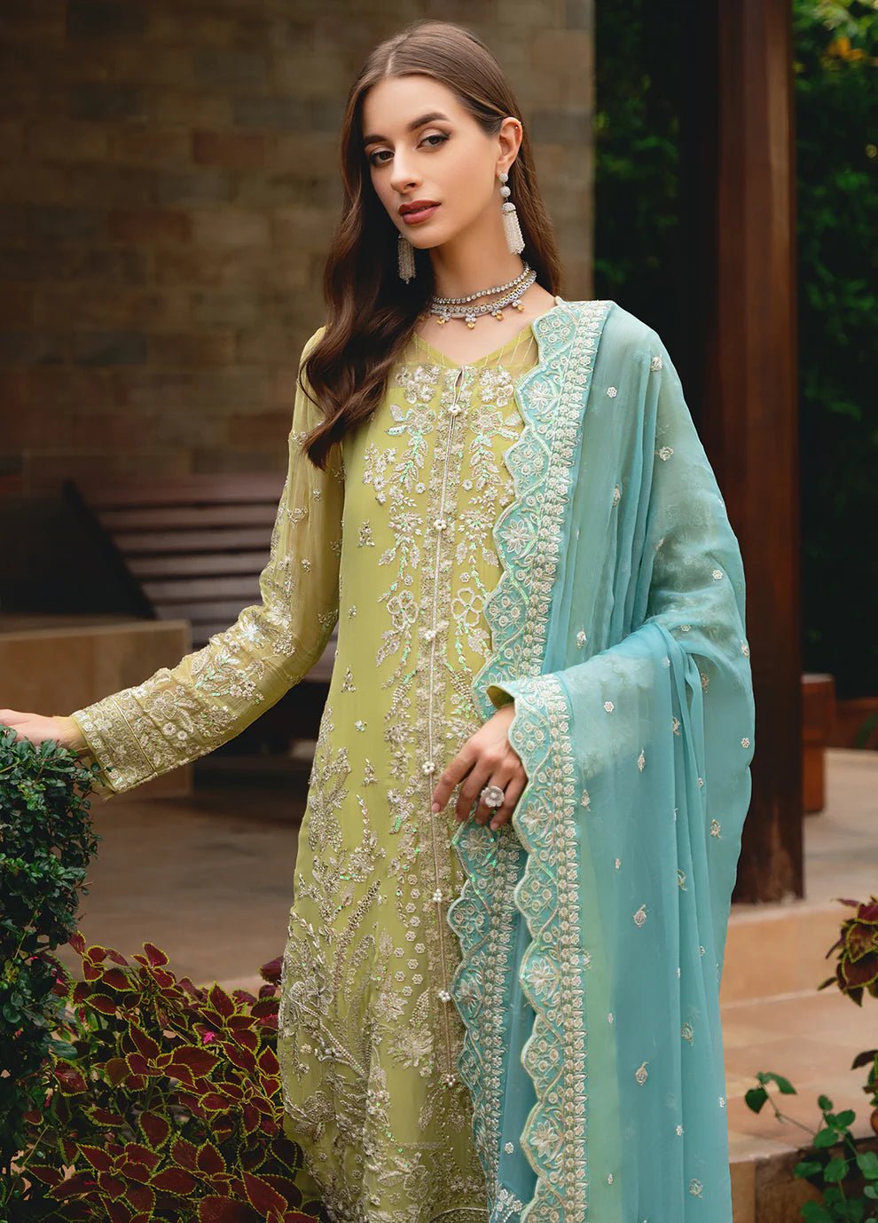 Model wearing Gulaal AMARY dress, a blend of olive and sea green, perfect for Pakistani clothes UK enthusiasts.