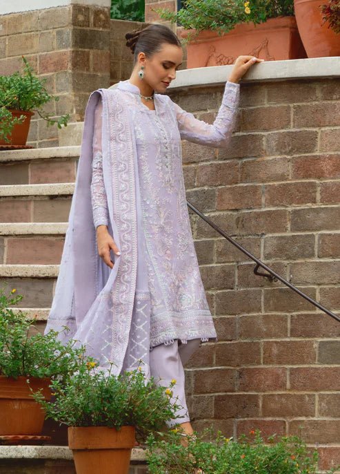 Model wearing Gulaal ARIYA dress, lavender embroidered Pakistani attire UK.