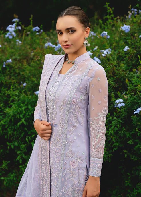 Model wearing Gulaal ARIYA dress, lavender embroidered Pakistani attire UK.