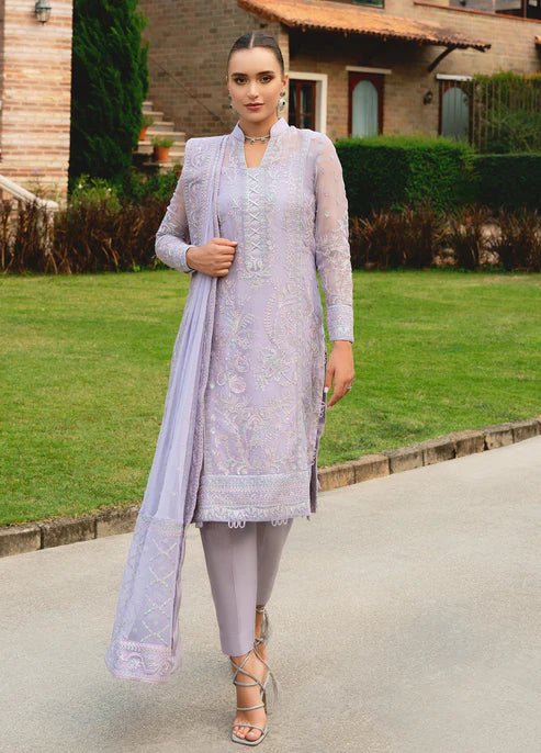 Model wearing Gulaal ARIYA dress, lavender embroidered Pakistani attire UK.