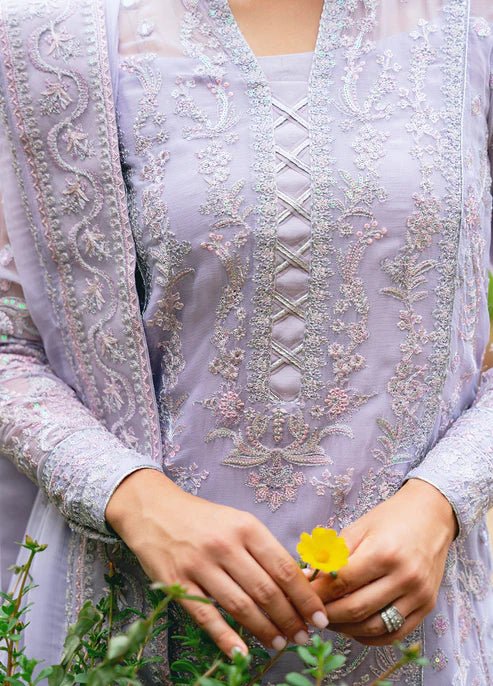 Model wearing Gulaal ARIYA dress, lavender embroidered Pakistani attire UK.