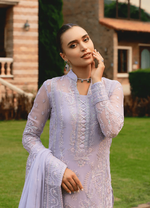 Model wearing Gulaal ARIYA dress, lavender embroidered Pakistani attire UK.