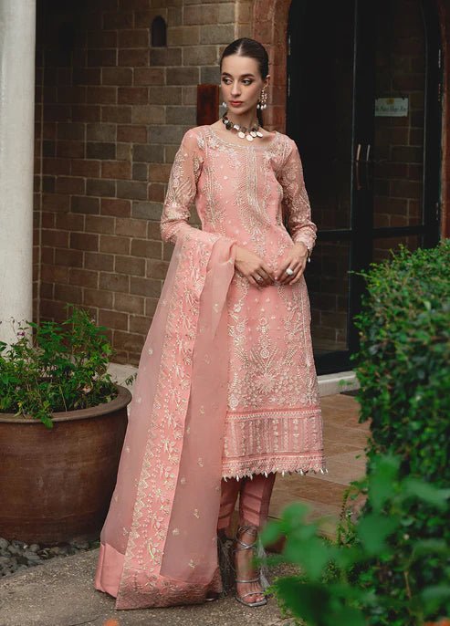 Model wearing Gulaal CRESSIDA dress, peach Pakistani clothing UK.