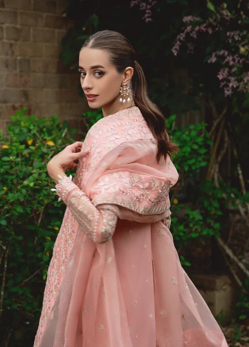 Model wearing Gulaal CRESSIDA dress, peach Pakistani clothing UK.