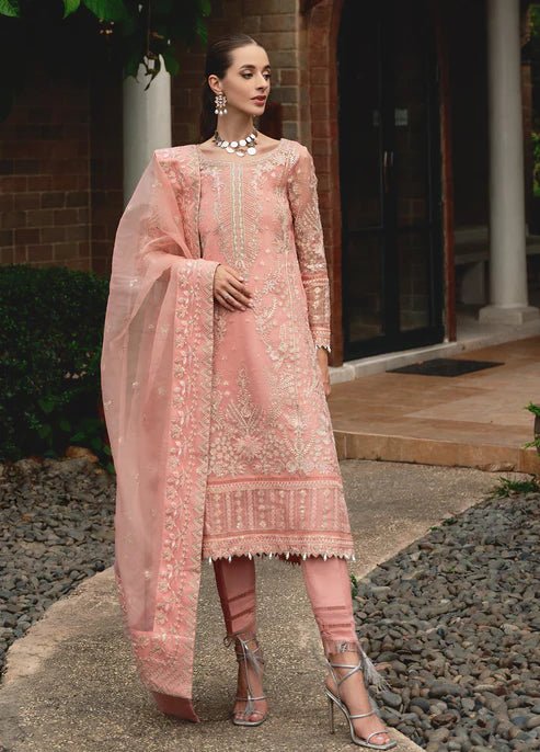 Model wearing Gulaal CRESSIDA dress, peach Pakistani clothing UK.