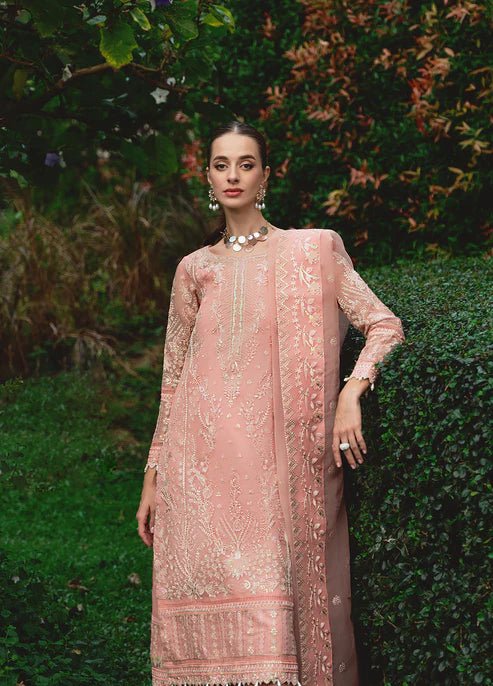 Model wearing Gulaal CRESSIDA dress, peach Pakistani clothing UK.