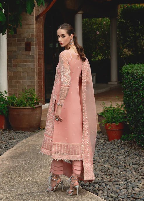Model wearing Gulaal CRESSIDA dress, peach Pakistani clothing UK.