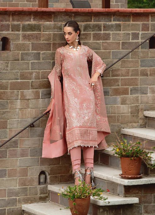 Model wearing Gulaal CRESSIDA dress, peach Pakistani clothing UK.