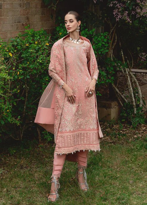Model wearing Gulaal CRESSIDA dress, peach Pakistani clothing UK.