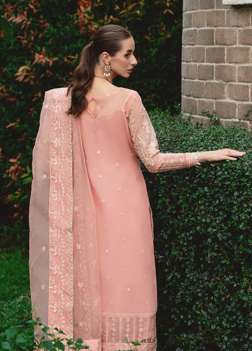 Model wearing Gulaal CRESSIDA dress, peach Pakistani clothing UK.