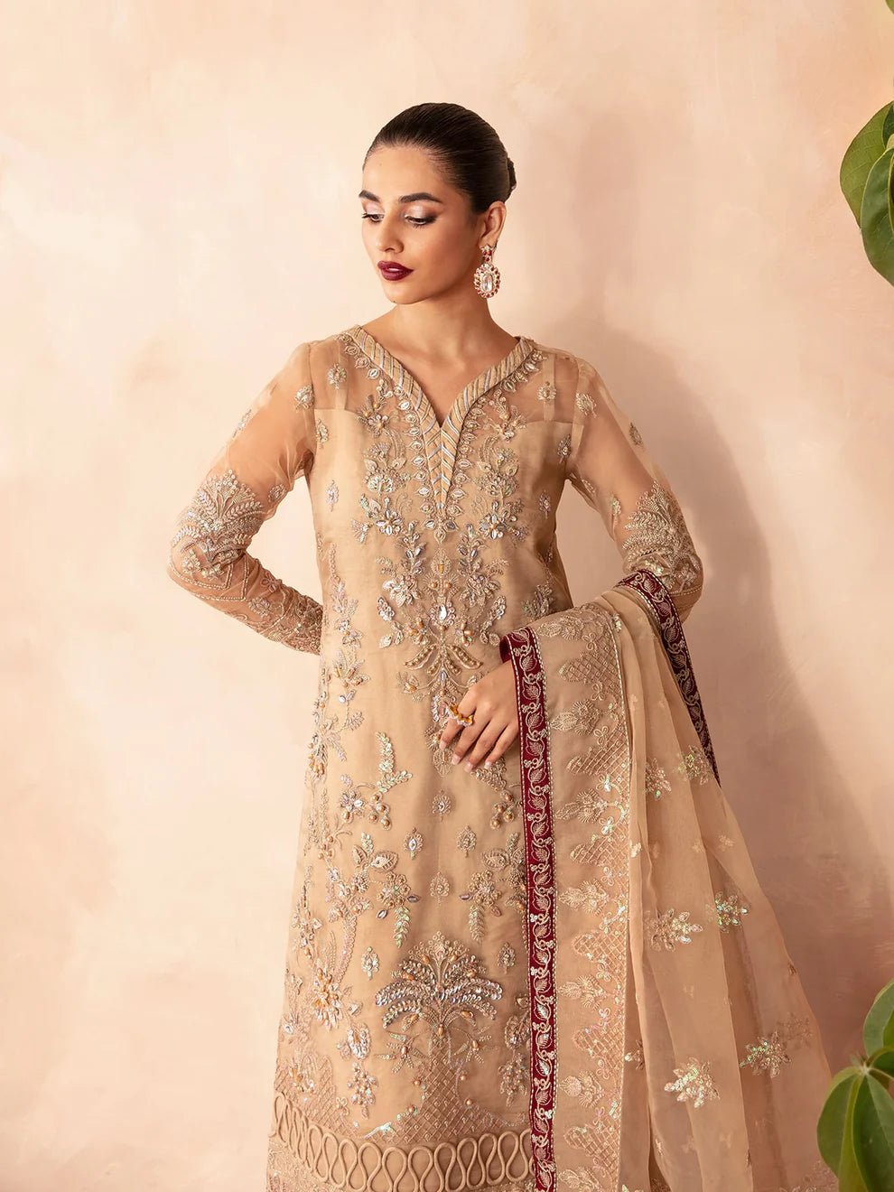 Model wearing Gulaal Luxury Pret EMILIA GL - LP - V2 - 14 dress in beige with intricate embroidery. Perfect for Pakistani clothes online in UK.