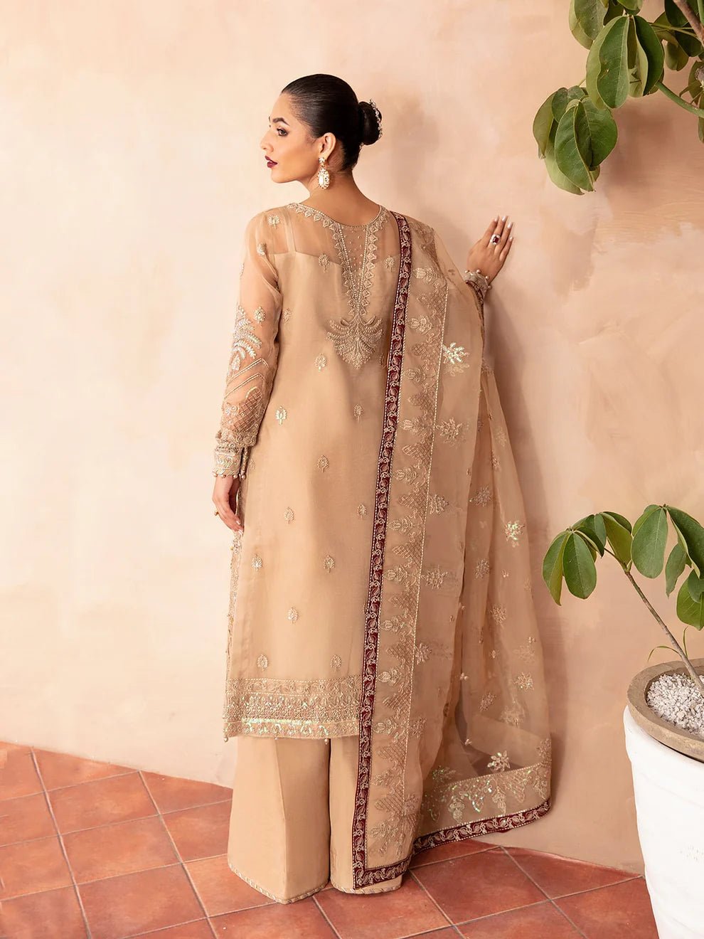 Model wearing Gulaal Luxury Pret EMILIA GL - LP - V2 - 14 dress in beige with intricate embroidery. Perfect for Pakistani clothes online in UK.