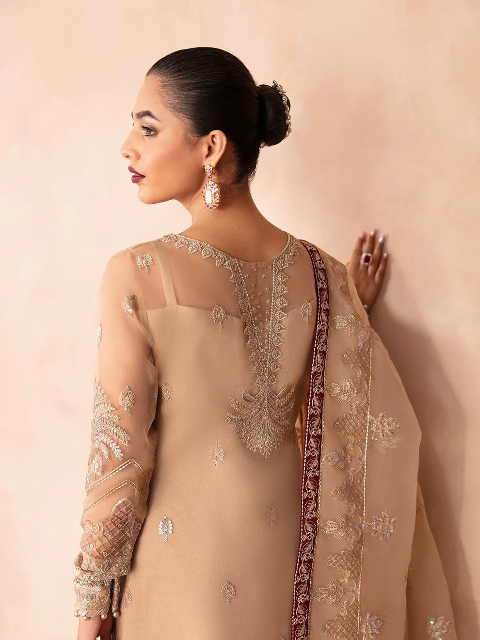 Model wearing Gulaal Luxury Pret EMILIA GL - LP - V2 - 14 dress in beige with intricate embroidery. Perfect for Pakistani clothes online in UK.